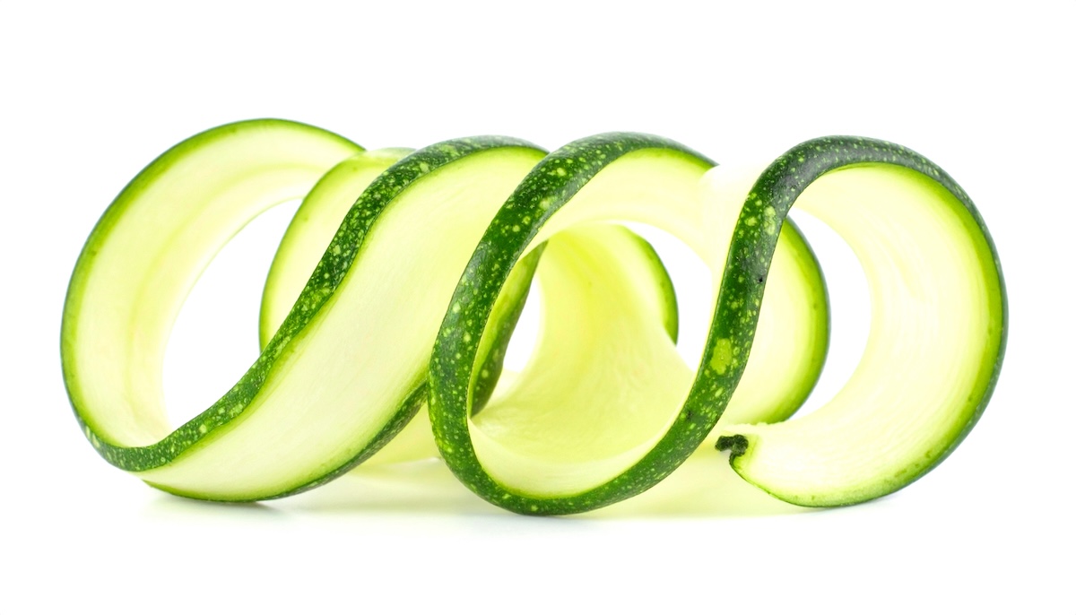 Delicate,Thin,Curled,Spiral,Ribbon,Of,Fresh,Raw,Green,Zucchini Delicate,Thin,Curled,Spiral,Ribbon,Of,Fresh,Raw,Green,Zucchini