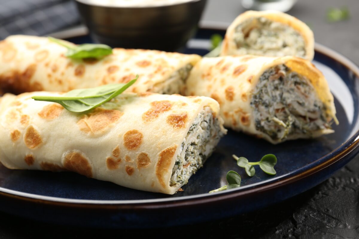 Delicious,Crepes,With,Cottage,Cheese,And,Spinach,On,Black,Table, Delicious,Crepes,With,Cottage,Cheese,And,Spinach,On,Black,Table,