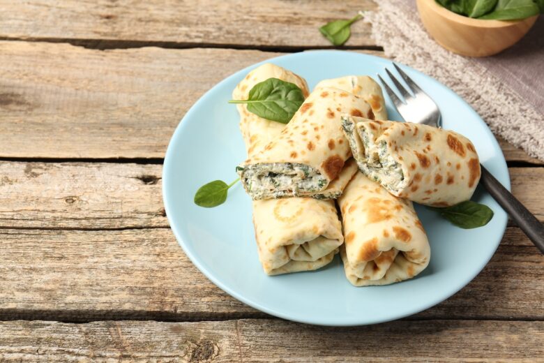 Tasty,Rolled,Crepes,With,Cottage,Cheese,And,Spinach,Served,On