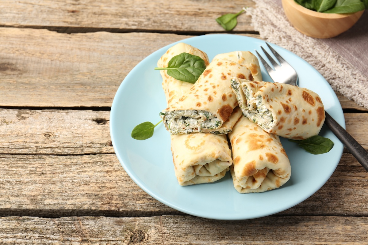 Tasty,Rolled,Crepes,With,Cottage,Cheese,And,Spinach,Served,On Tasty,Rolled,Crepes,With,Cottage,Cheese,And,Spinach,Served,On