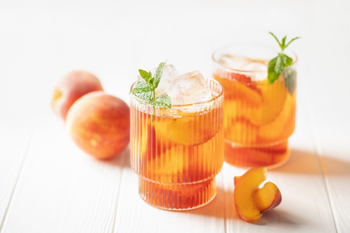 Peaches,Iced,Tea,In,A,Glass,On,The,Table.,Summer Peaches,Iced,Tea,In,A,Glass,On,The,Table.,Summer