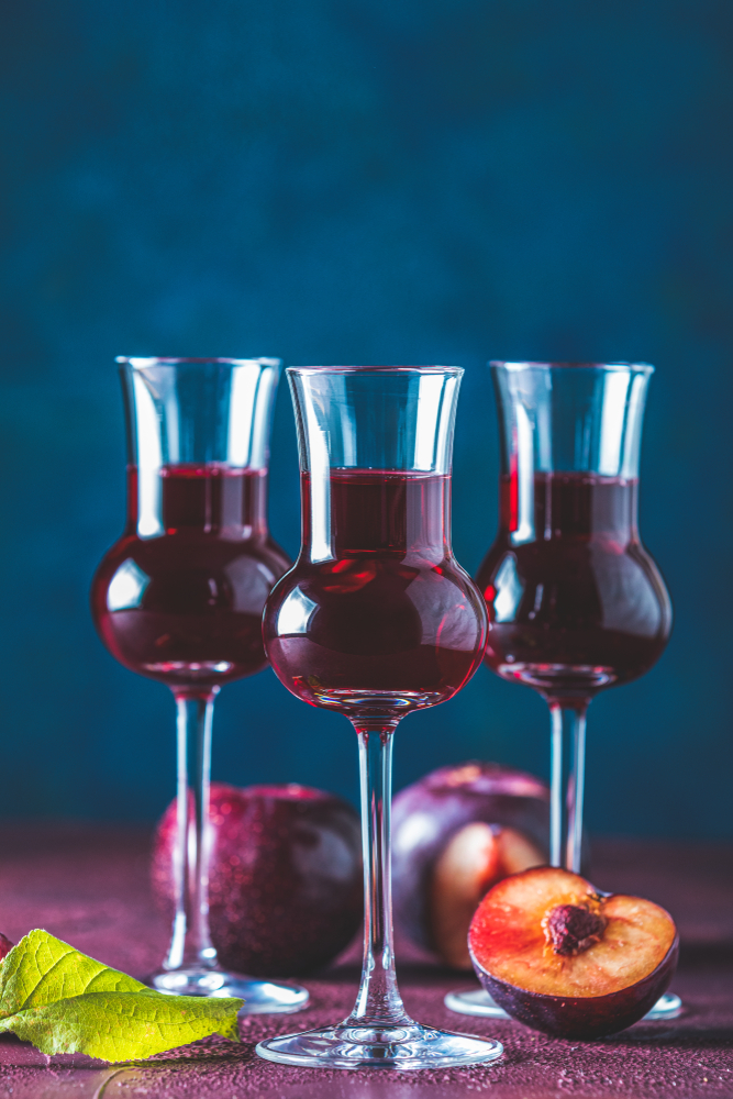 Plums,Strong,Alcoholic,Drink,In,Grappas,Wineglass,With,Dew.,Hard Plums,Strong,Alcoholic,Drink,In,Grappas,Wineglass,With,Dew.,Hard