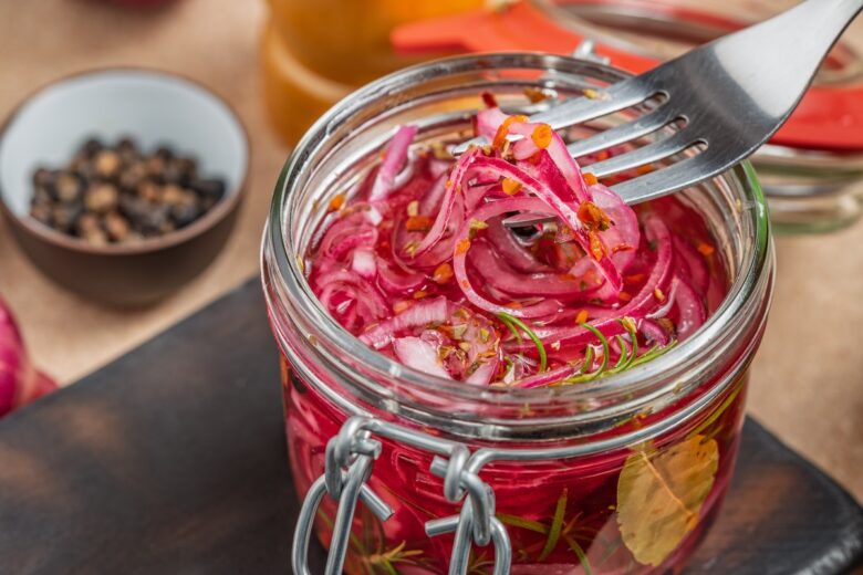Pickled,Red,Onions,In,A,Glass,Jar,With,Spices,And
