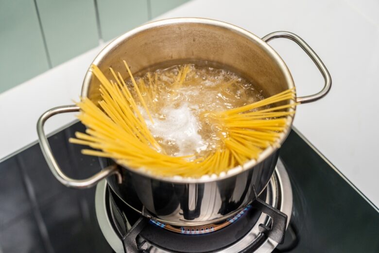 Long,Spaghetti,Strands,Soften,As,They,Boil,Bubbling,Water.,Spaghetti
