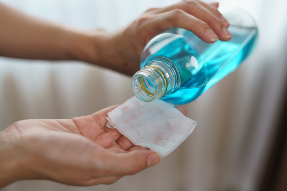 Pouring,Ethyl,Alcohol,From,Bottle,Into,A,Cotton,Piece,For Pouring,Ethyl,Alcohol,From,Bottle,Into,A,Cotton,Piece,For