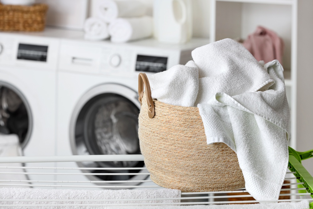 Freshly,Washed,White,Towels,In,Woven,Laundry,Basket,On,Drying Freshly,Washed,White,Towels,In,Woven,Laundry,Basket,On,Drying