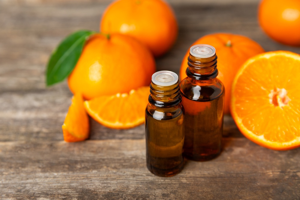 Tangerine,Essential,Oil,On,A,Wooden,Table.,Bottles,Of,Citrus Tangerine,Essential,Oil,On,A,Wooden,Table.,Bottles,Of,Citrus