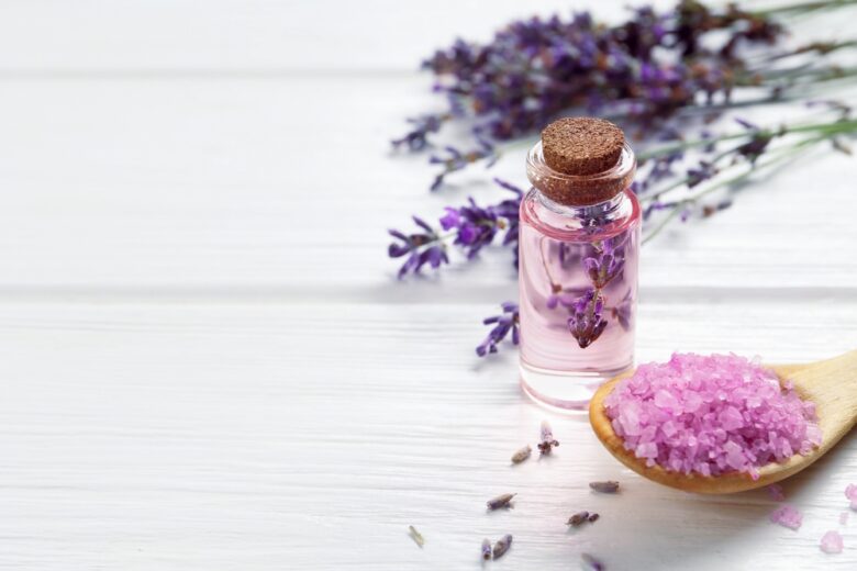Lavender,Essential,Oil,,Flowers,And,Sea,Salt,On,White,Wooden