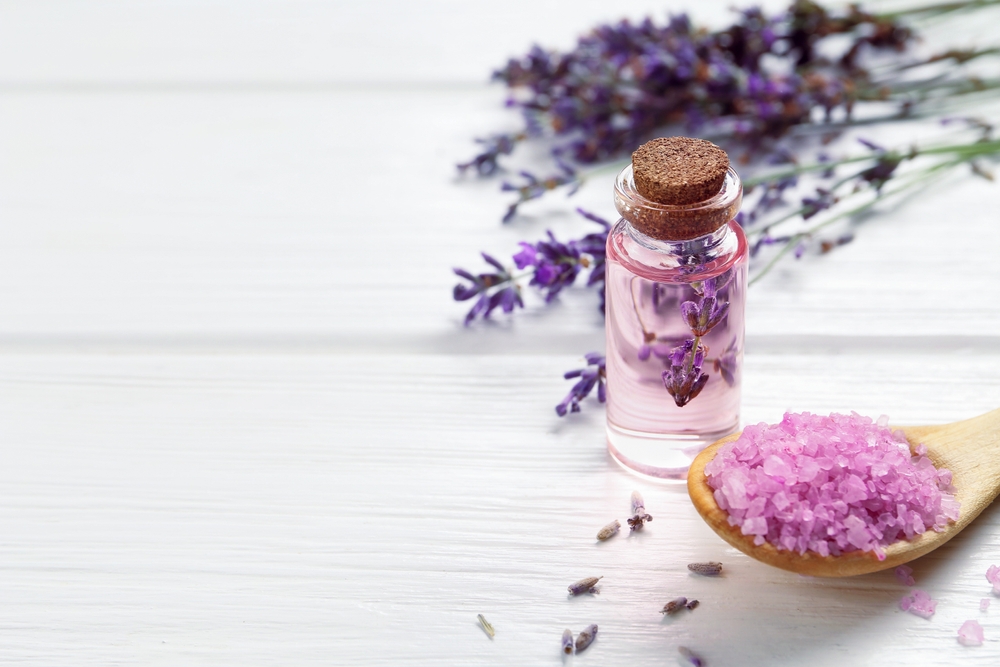 Lavender,Essential,Oil,,Flowers,And,Sea,Salt,On,White,Wooden Lavender,Essential,Oil,,Flowers,And,Sea,Salt,On,White,Wooden